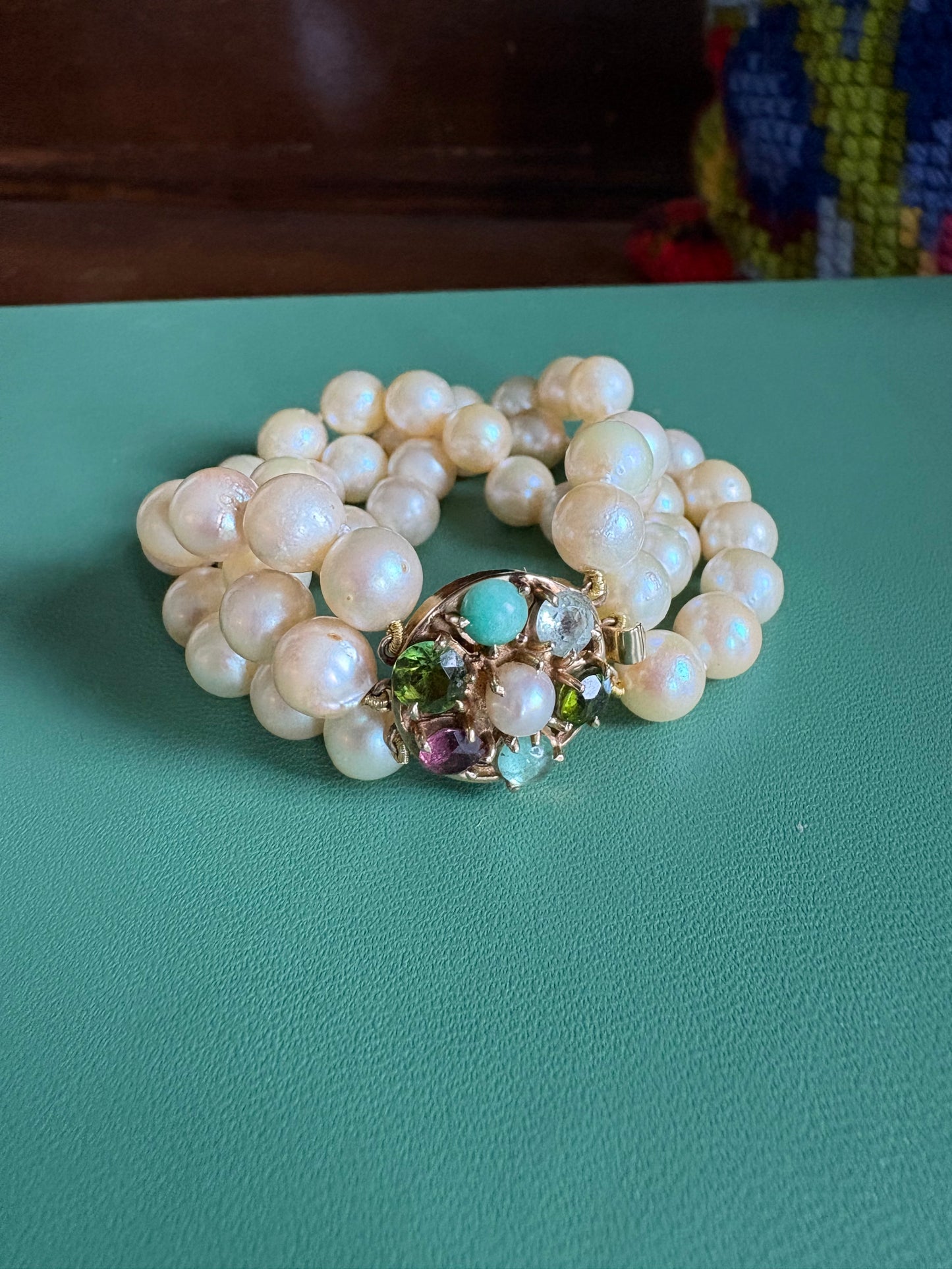 Triple Strnaded Pearl bracelt with Multicolored Gold Clasp