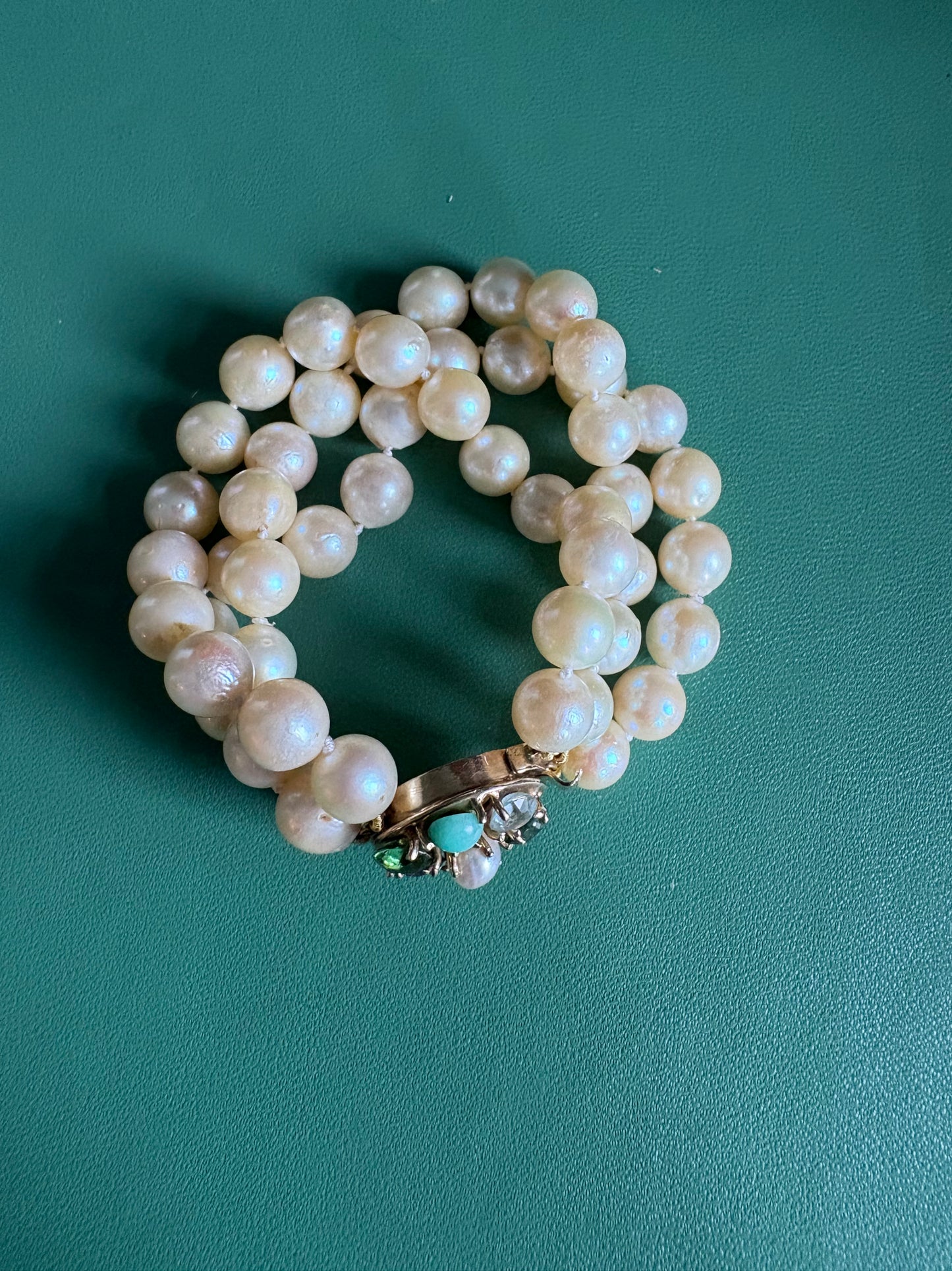 Triple Strnaded Pearl bracelt with Multicolored Gold Clasp