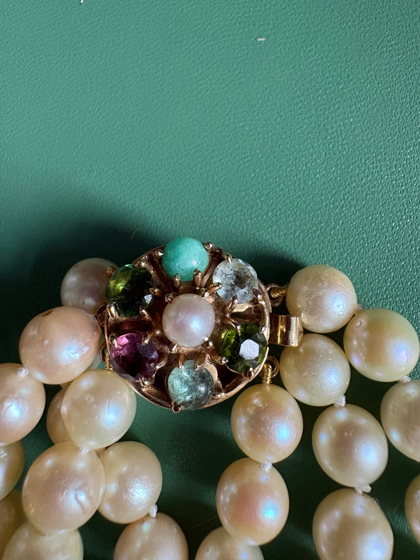 Triple Strnaded Pearl bracelt with Multicolored Gold Clasp
