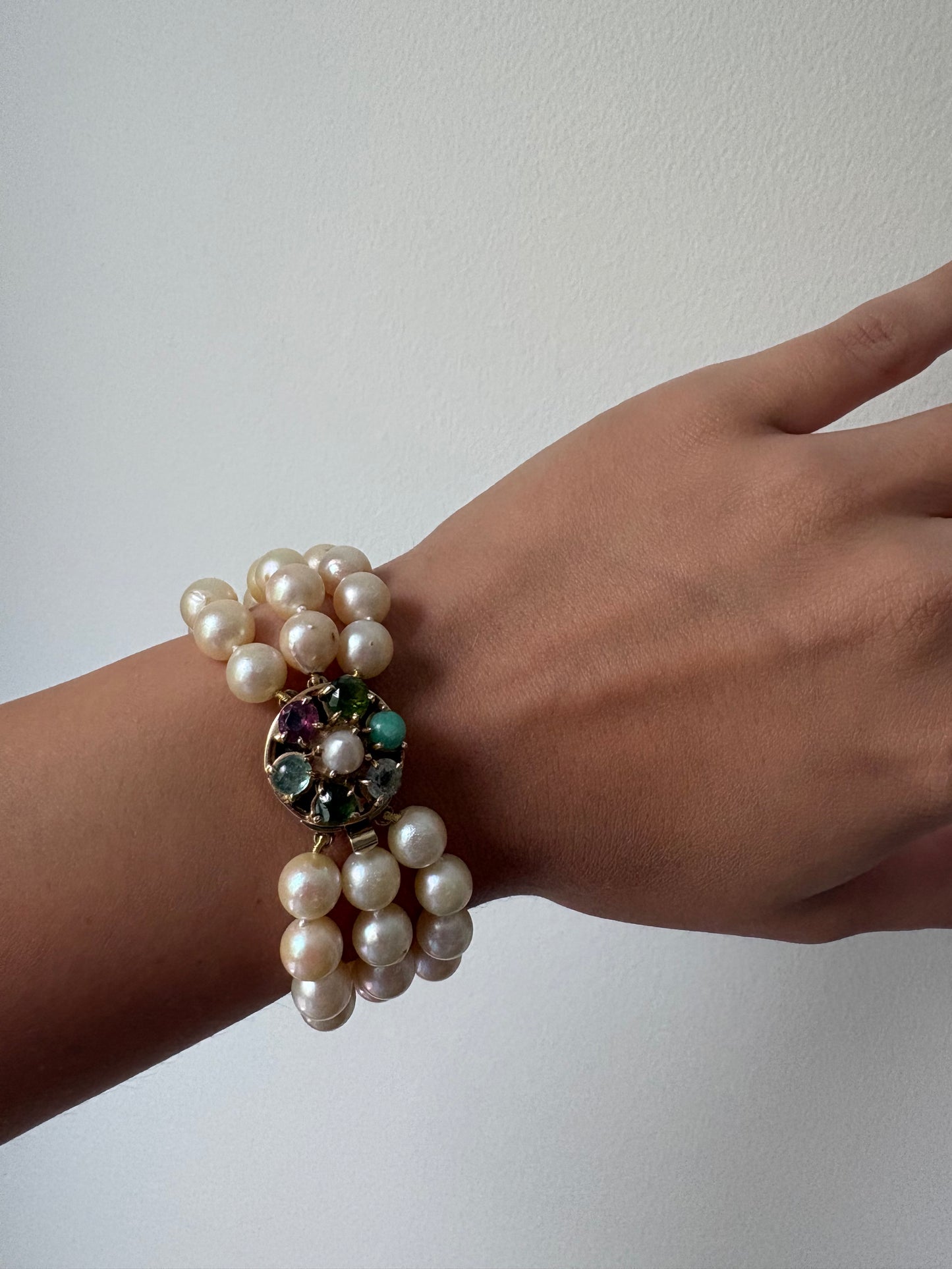Triple Strnaded Pearl bracelt with Multicolored Gold Clasp